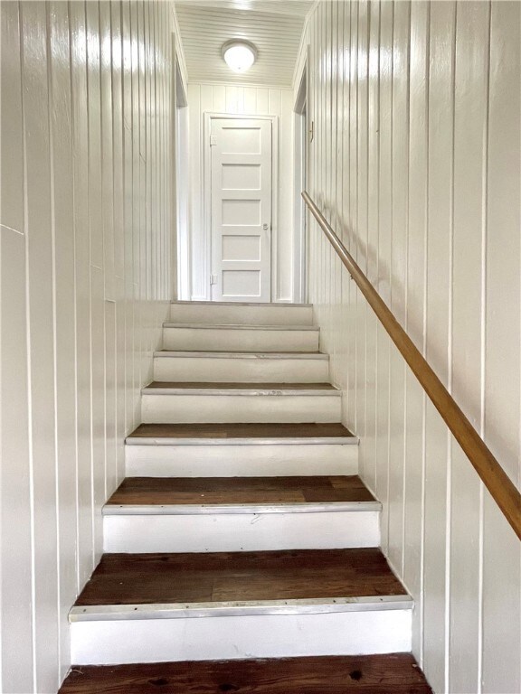 Staircase with wood walls