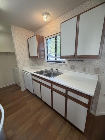 Kitchen with brown cabinets, dark wood-style floo