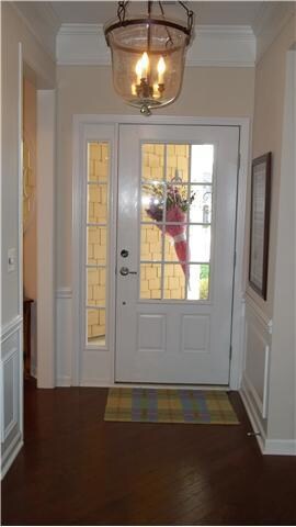 Crown molding, chair molding, and hardwood floors greet you in the foyer as you enter this beautiful home.