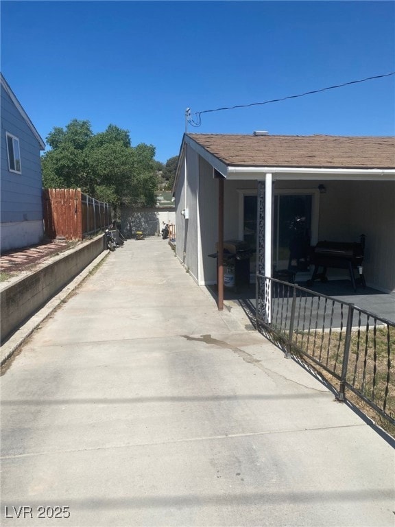 View of side of home featuring a patio area