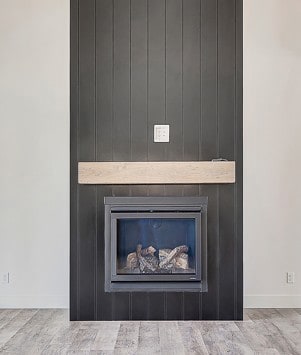 (PHOTO OF SIMILAR HOME)Detailed view of wood finished floors and a fireplace