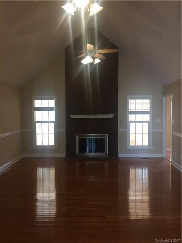 Family room with gas fireplace and vaulted ceiling