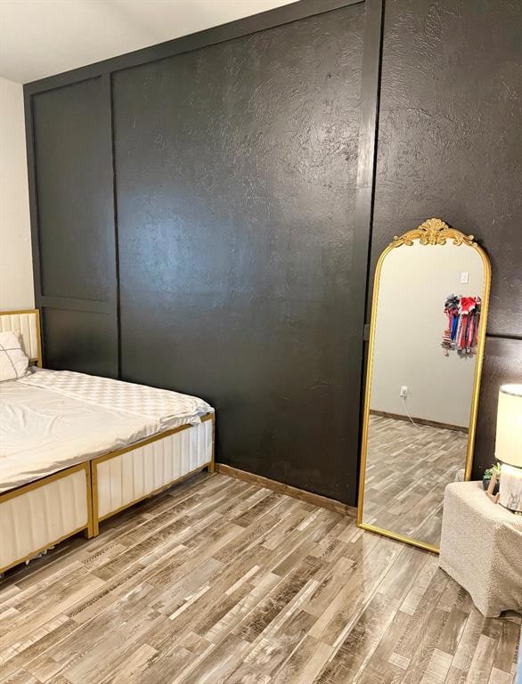 Bedroom with wood finished floors