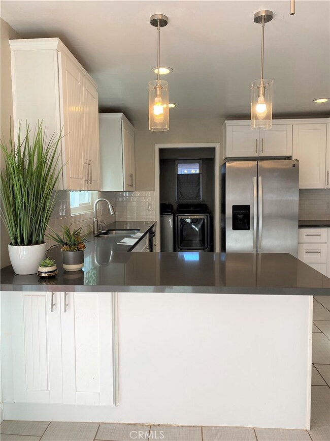 KITCHEN HAS LARGE COUNTER AREAS.