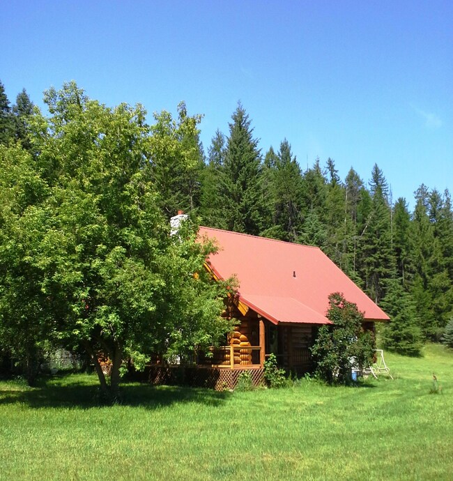 Log home, meadow, trees, creek