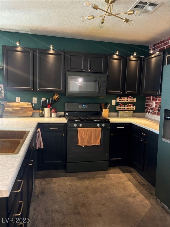 Kitchen with black appliances, visible vents, a ch