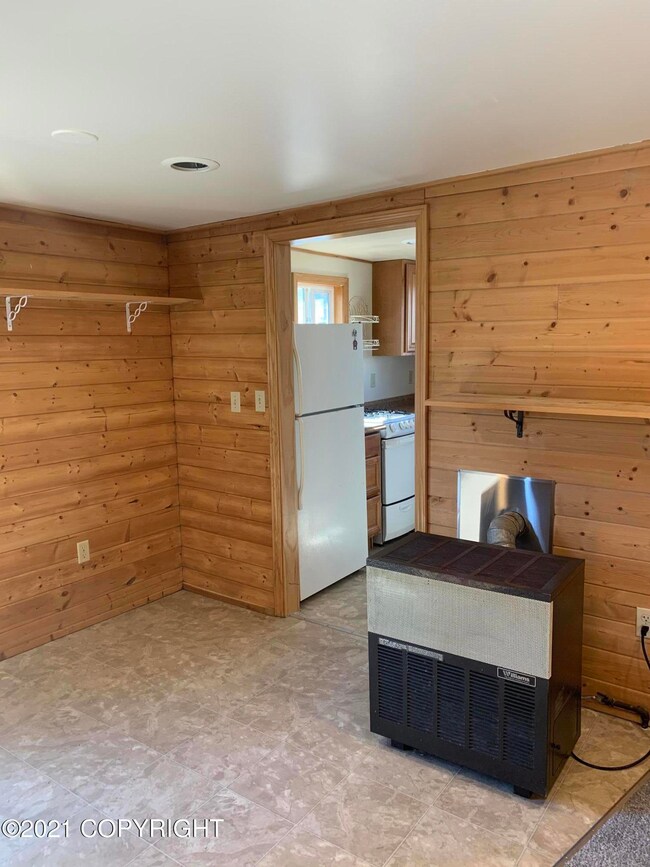 living room/eating nook next to kitchen