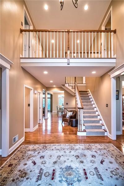 Greet your guests in the double height entry featu
