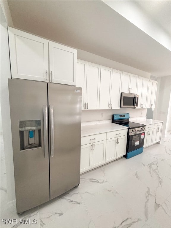 Kitchen featuring appliances with stainless steel