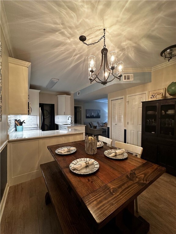 Dining and View of Kitchen and Den