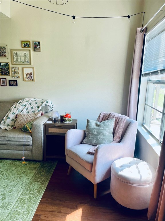 Living area with wood finished floors