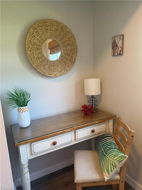 Detailed view of built in desk and wood finished floors