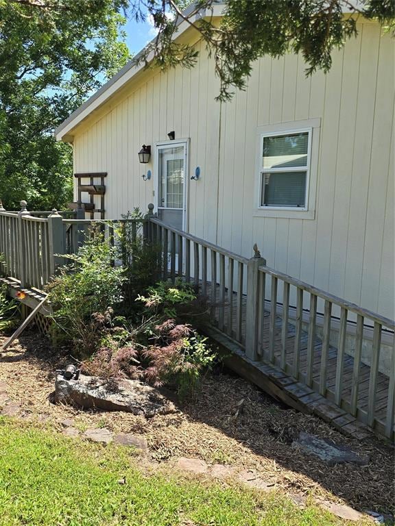 View of home's exterior featuring a wooden deck