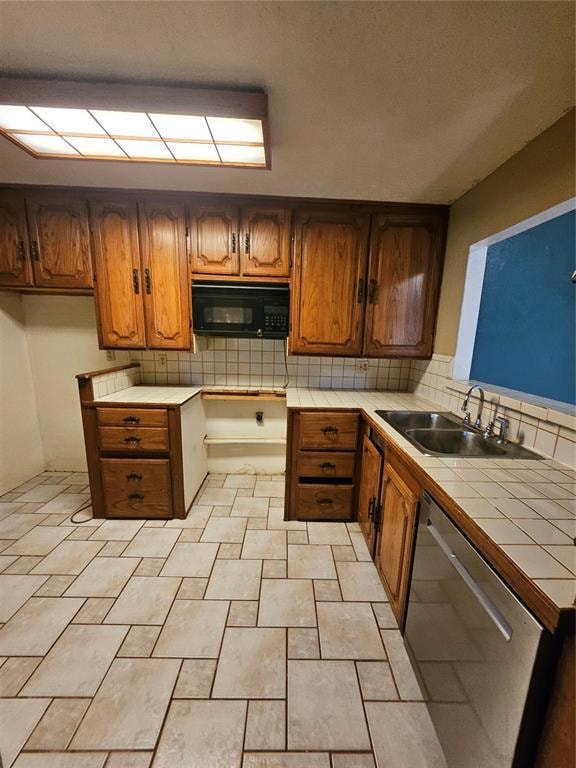 Kitchen featuring decorative backsplash, tile countertops, dishwashing machine, and brown cabinetry