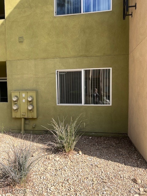 View of side of property featuring mail area