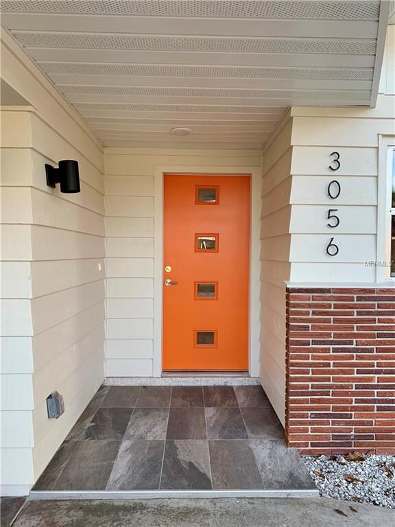 In keeping with its original design this home was fitted with mid century modern inspired doors and lighting.