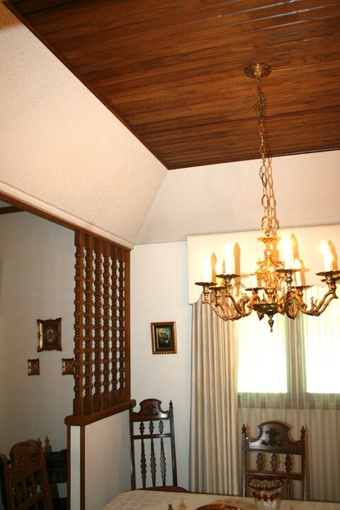 Unique wood insert in coffered ceiling.