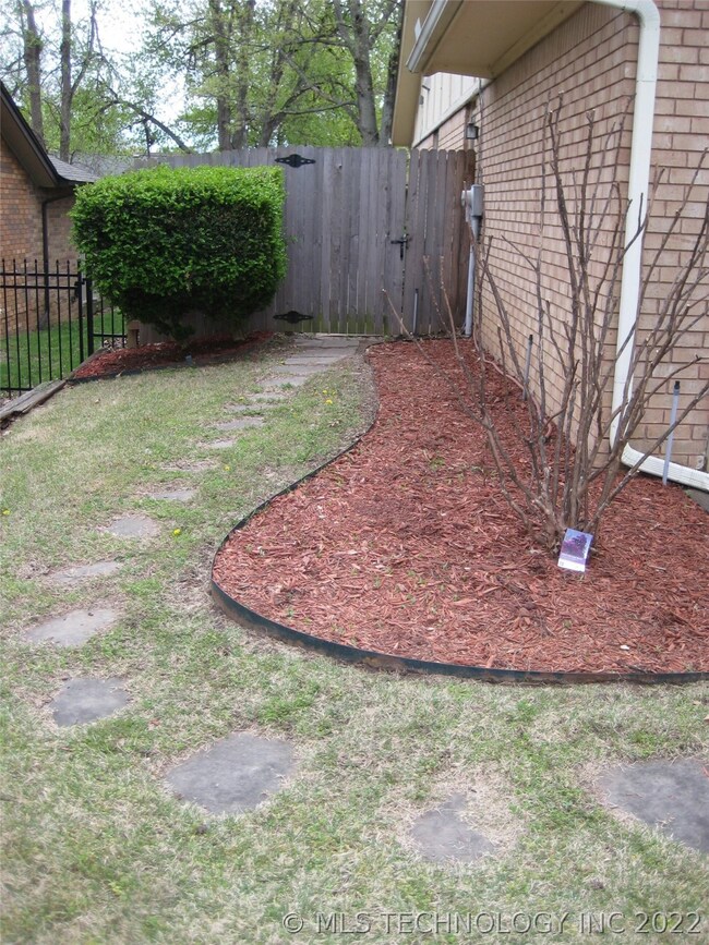 Left of Garage, Nice Flower Bed with Purple/Lavend