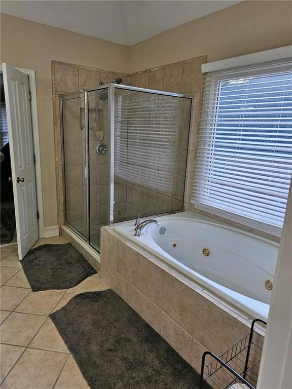 Bathroom with independent shower and bath and tile