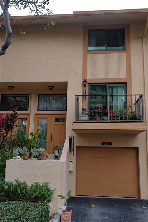 Exterior of 3 level townhouse with garage