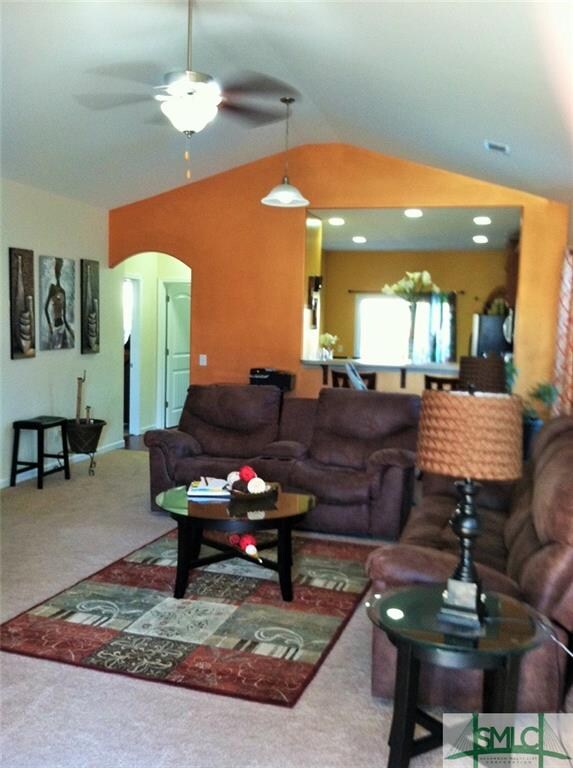 Living Room opens to kitchen with breakfast bar