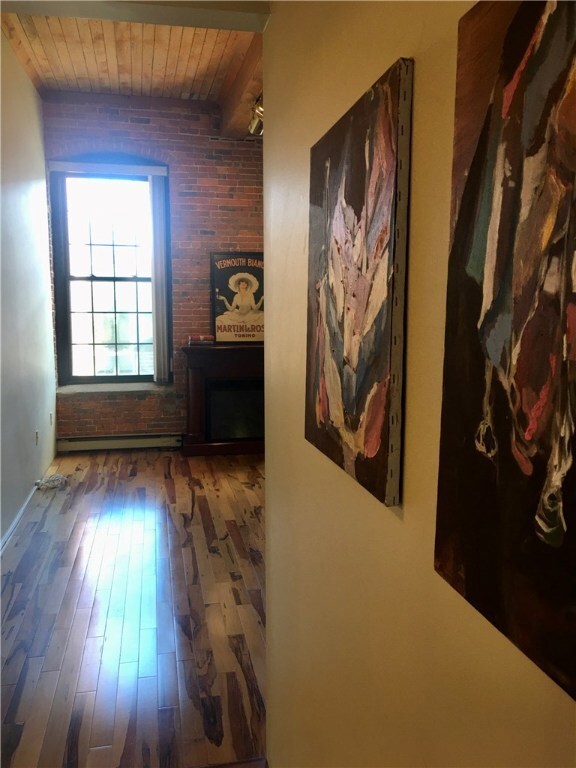 Hallway as you enter the condo. There is a hall cl
