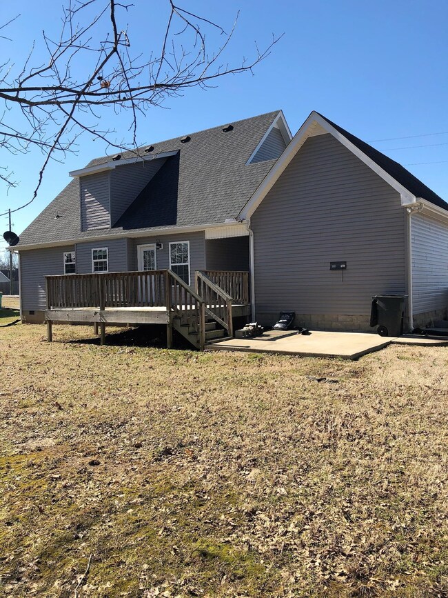 View from rear pf property. Features 14x10 Deck and 12x10 Patio.