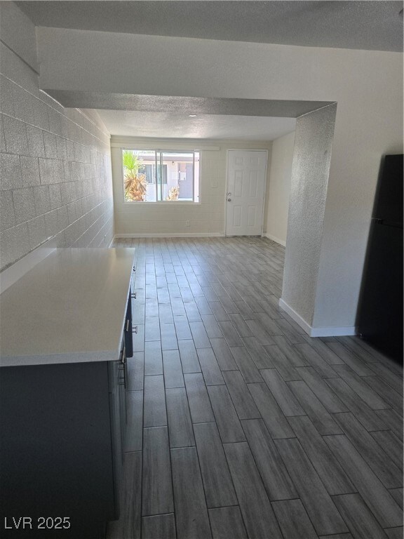 Unfurnished room with dark wood finished floors an