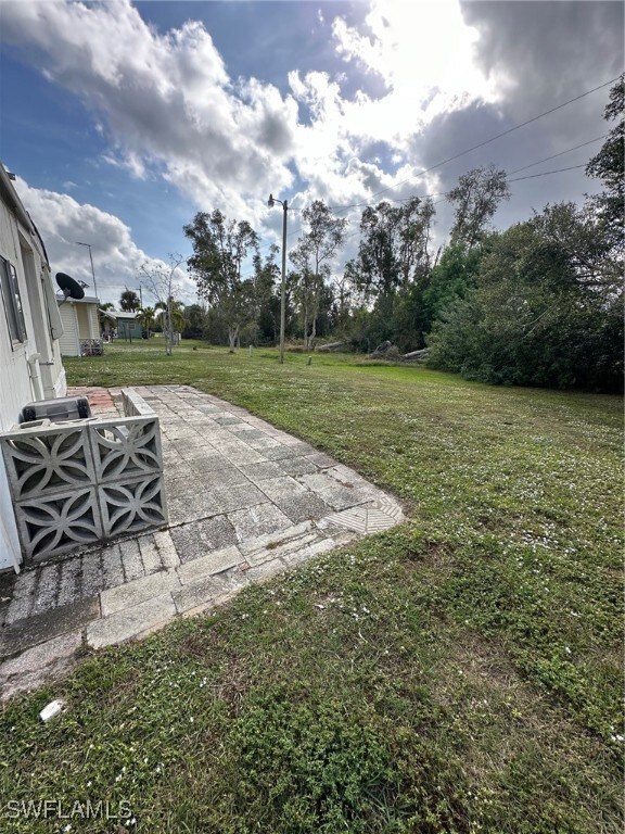 View of yard featuring a patio
