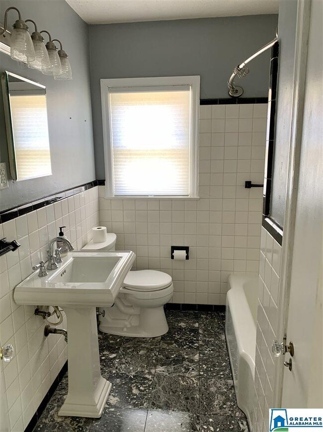 Marble Floors, Tub/Shower Combo, And A Linen Close