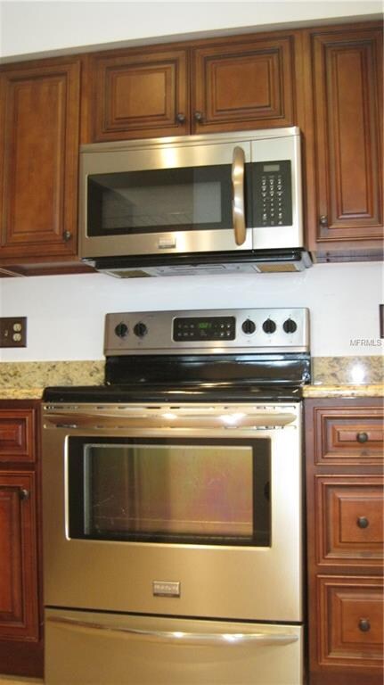 Newer stainless range, microwave.