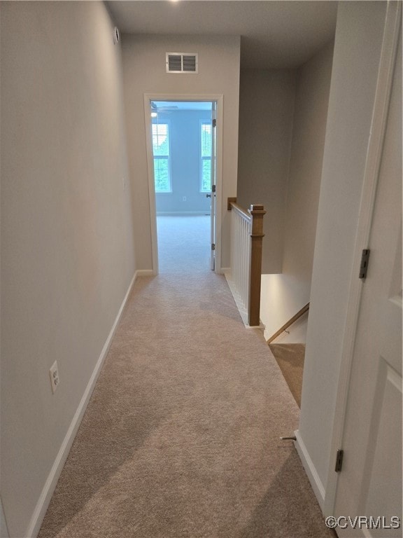 Hall with an upstairs landing, visible vents, carp