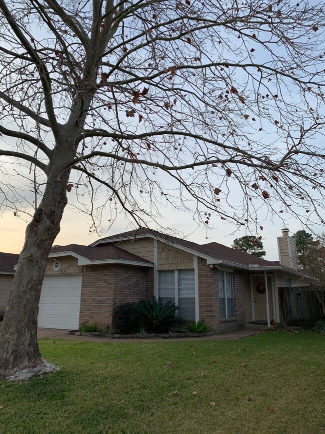 Cozy and welcoming 2 bedroom/2 bath home with nice landscaping in front, porch entry and lovely shade tree in front yard.