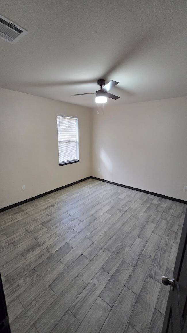 Bedroom 1, no carpet, offering a bright and spacio