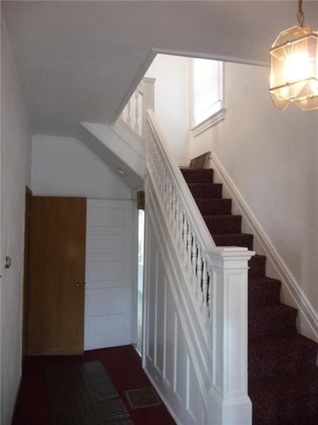 Entry hall and stairway.  Powder room is to the le