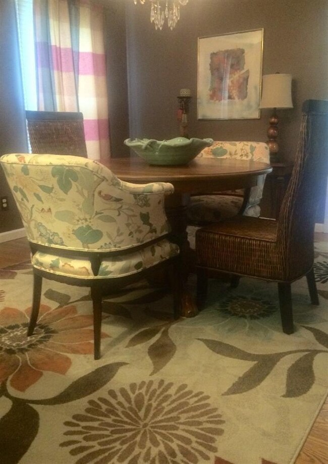 Forma Dining Room with chandelier & wood floors