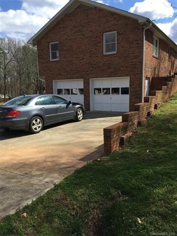 Two Car Garage fronts Secluded Lane