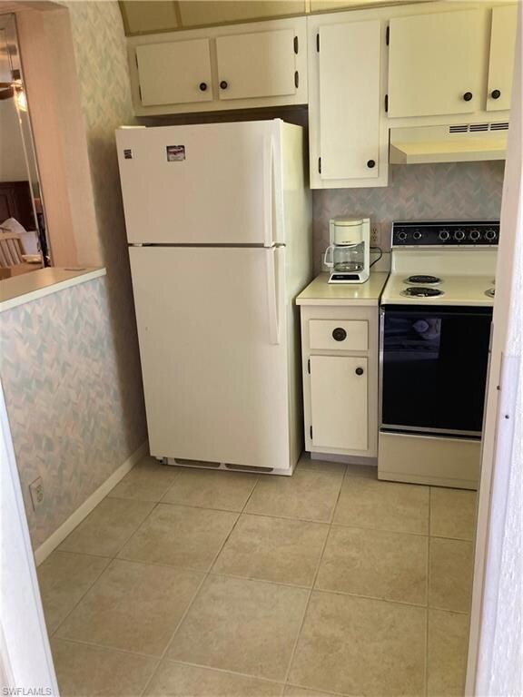 Kitchen with pass through to dining area