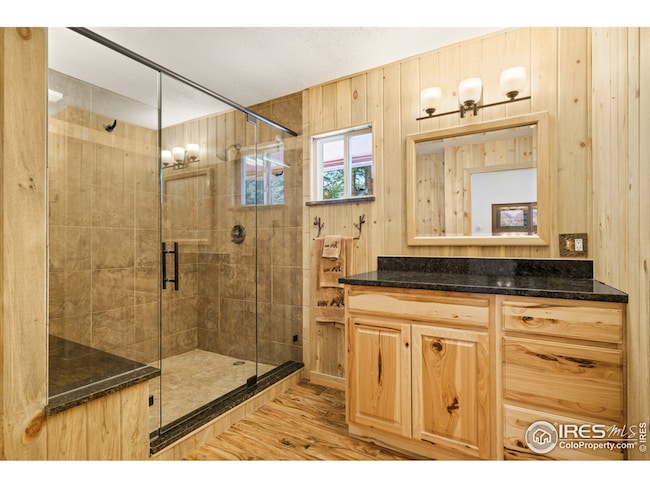 Spacious walk-in shower and ample counter space in the upper level bath.