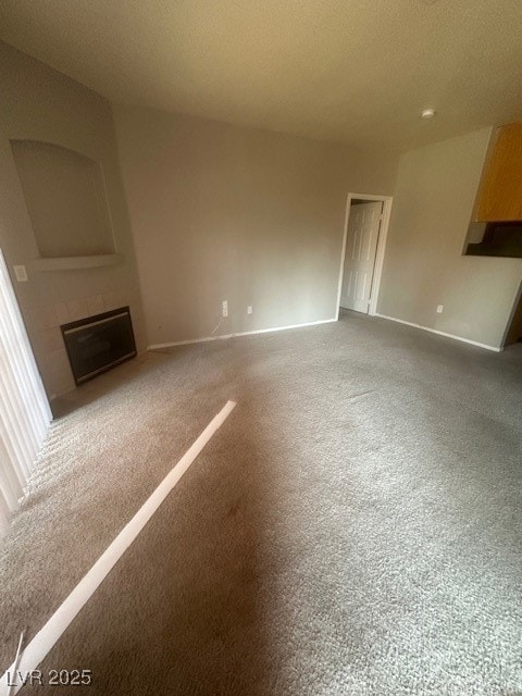 Unfurnished living room with a large fireplace, ca