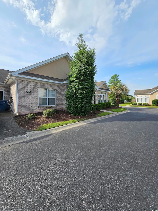 View of front of property with brick siding