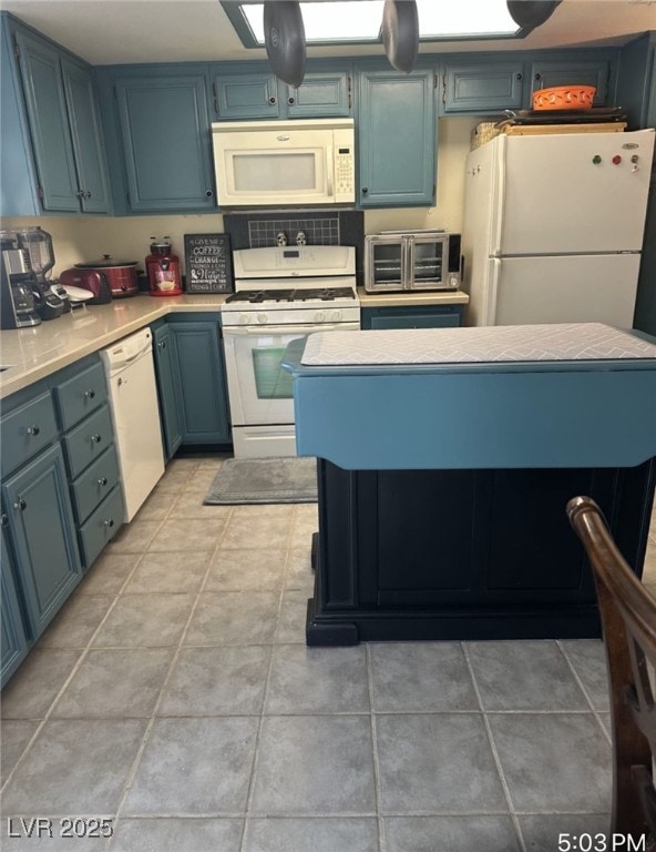 Kitchen featuring light tile patterned floors, whi