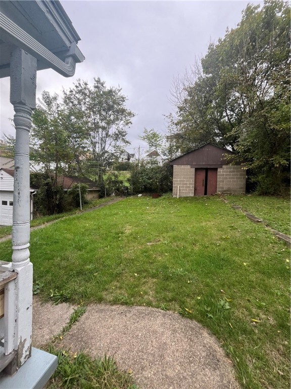 Large yard with a shed.