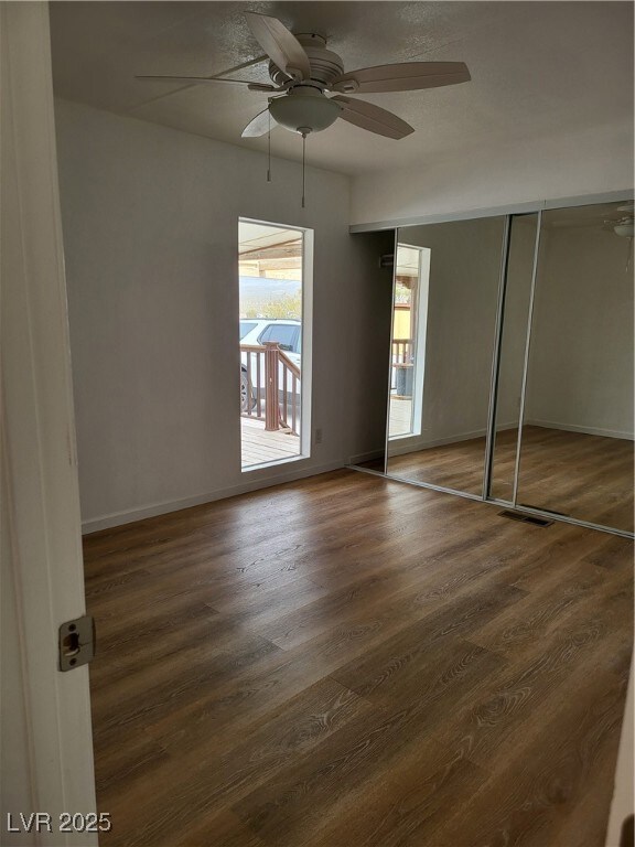 Unfurnished bedroom featuring visible vents, baseb