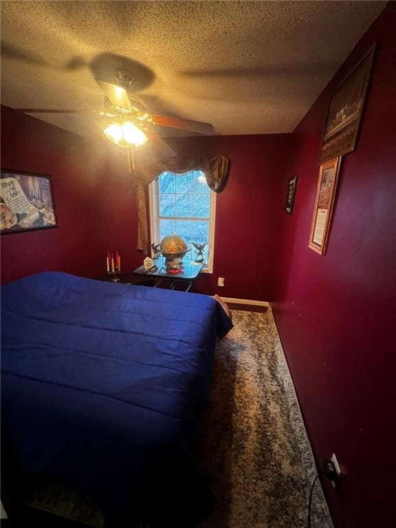 Carpeted bedroom with a textured ceiling and a cei