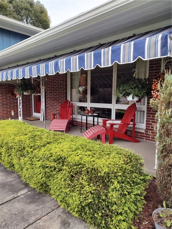 Covered front porch for relaxing in the shade of n