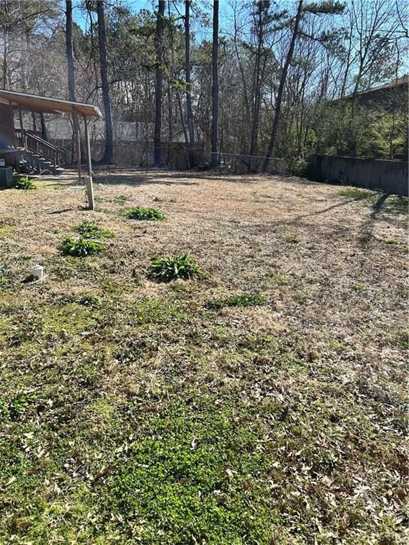 View of yard featuring fence