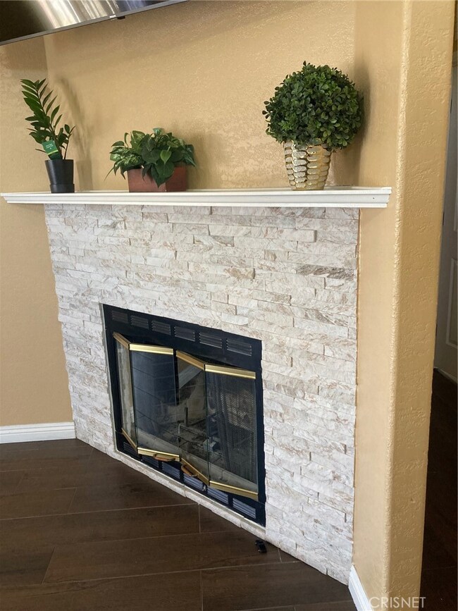 Wood-burning fireplace with lovely newer stone face