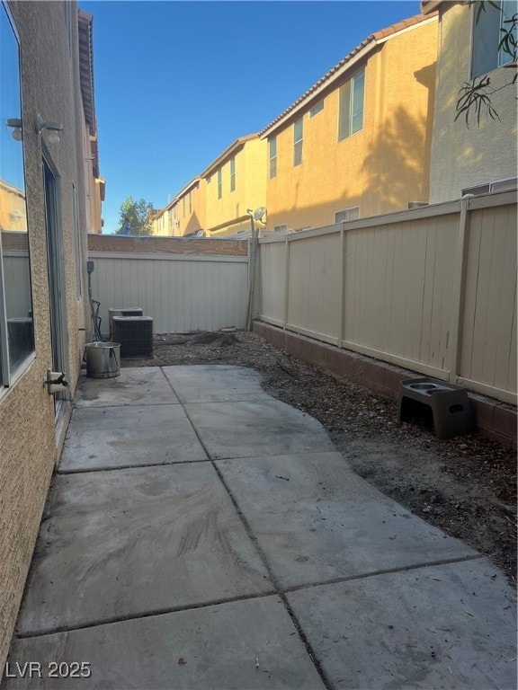 Fenced backyard with a patio area
