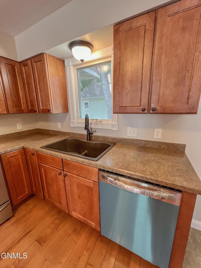 Kitchen with new dishwasher and sink
